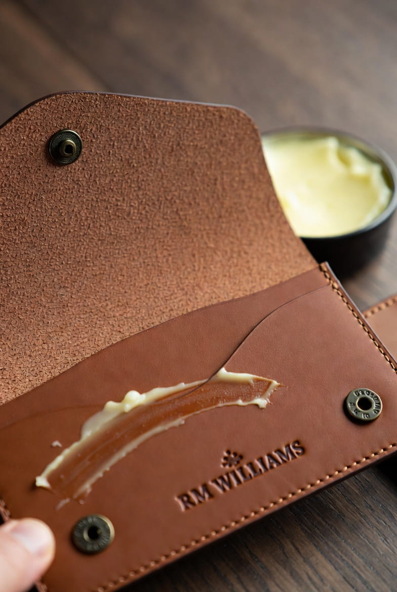 RM Williams wallet with leather conditioner being applied